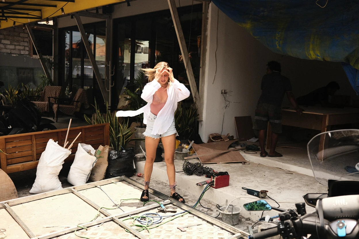 The empty boutique space during construction, with sandbags and tools on the floor