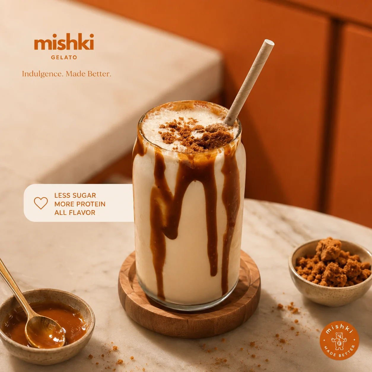 An iced Mishki frappe with caramel drizzle and biscuit crumble