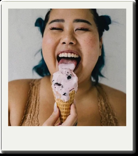 A woman licking a regular gelato cone